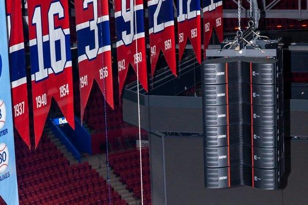 a large banner hanging from the ceiling of a stadium